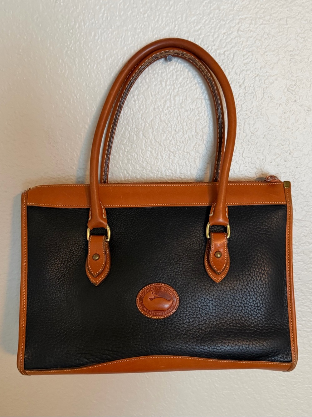 Dooney & Bourke Black with Tan Trim Pebbled Leather Satchel